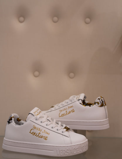 White sneaker with gold lettering