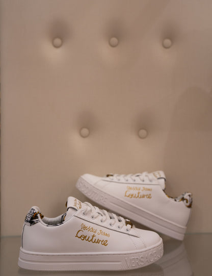 White sneaker with gold lettering