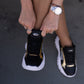 Black and gold sneaker