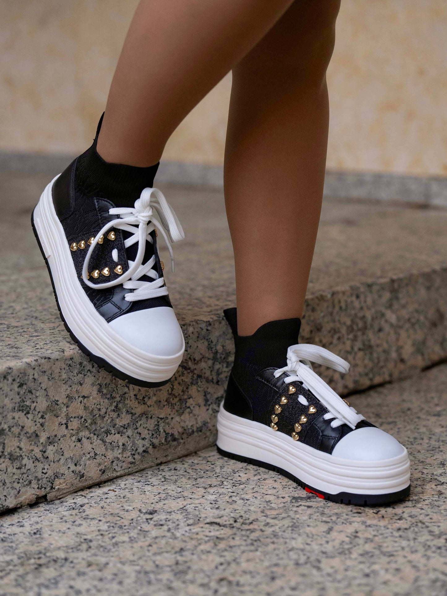 Black sneaker with double platform