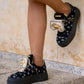 Black sneaker with gold details