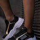 Black and gold sneaker