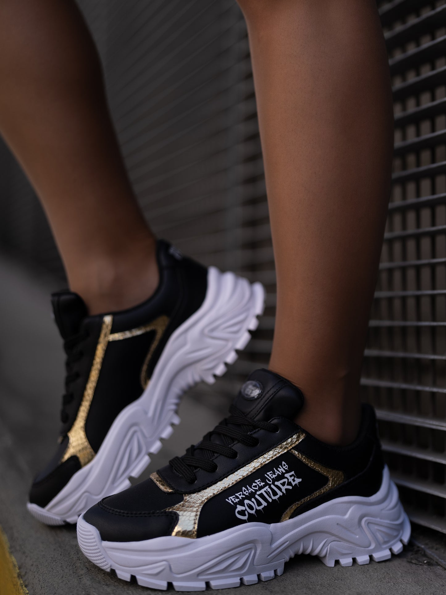 Black and gold sneaker