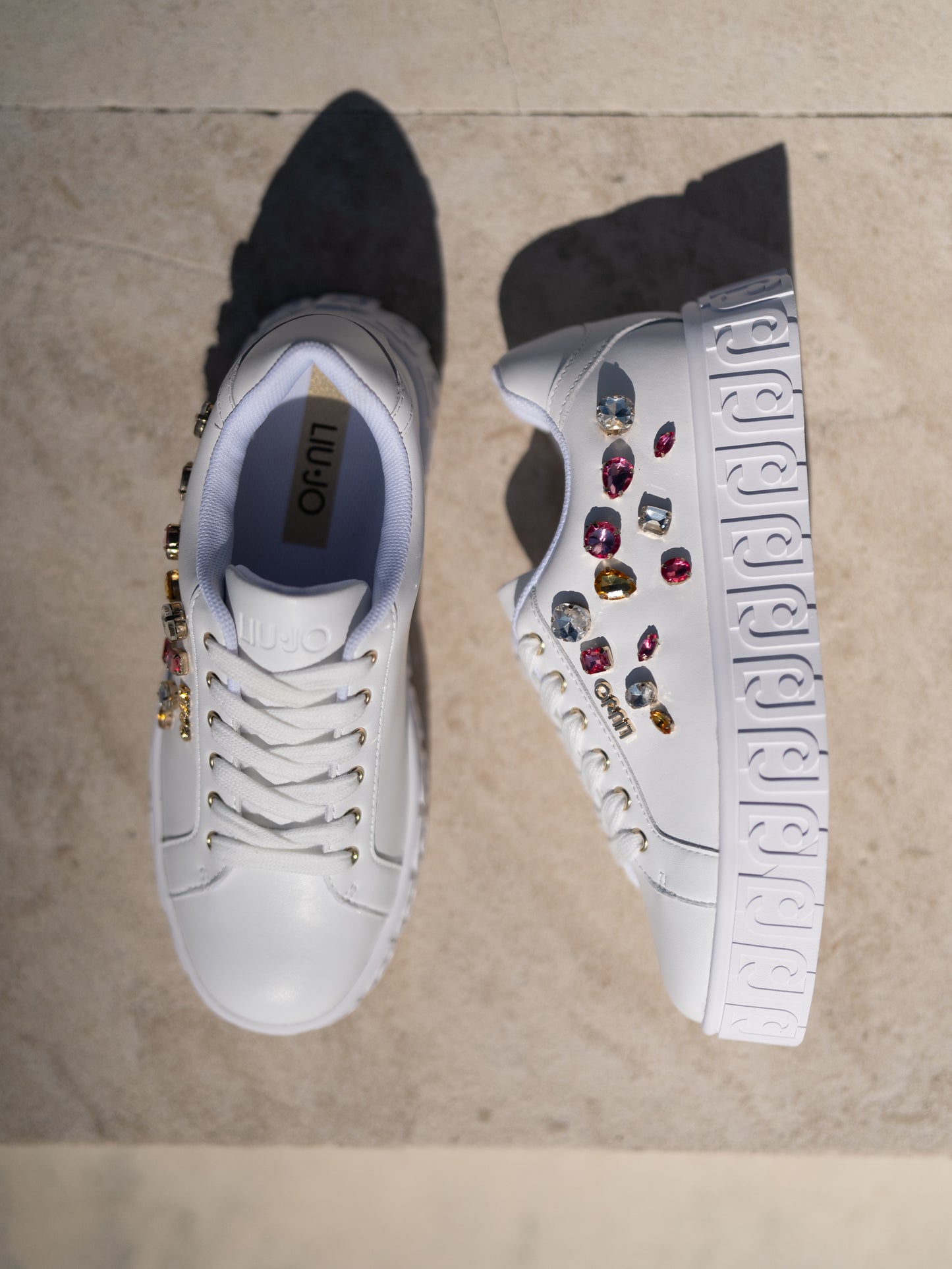 White sneakers with bejewelled gemstones