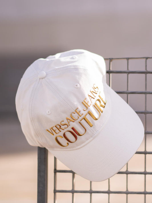 White cap with gold lettering