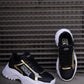 Black and gold sneaker