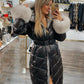 Padded black jacket with white fur