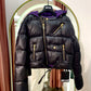 Black puffer jacket with purplw detail