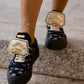 Black sneaker with gold details