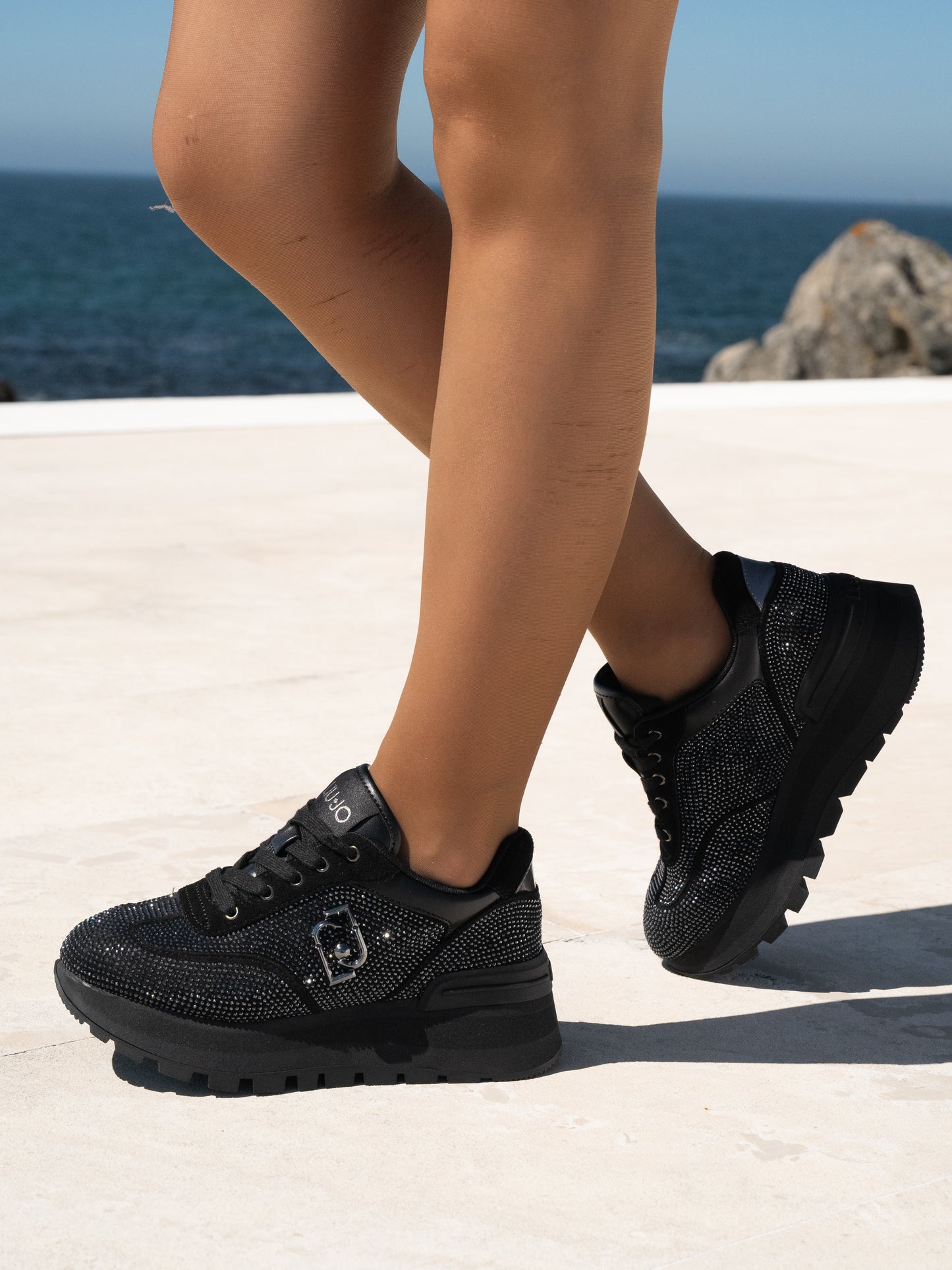 Black sneakers with all-over rhinestones