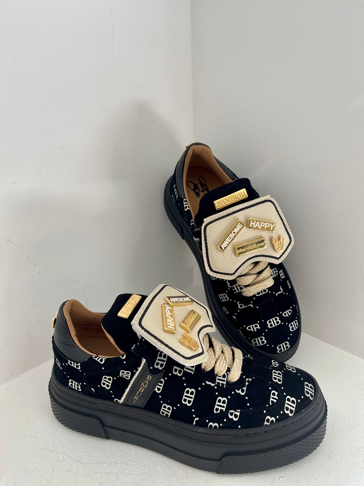 Black sneaker with gold details