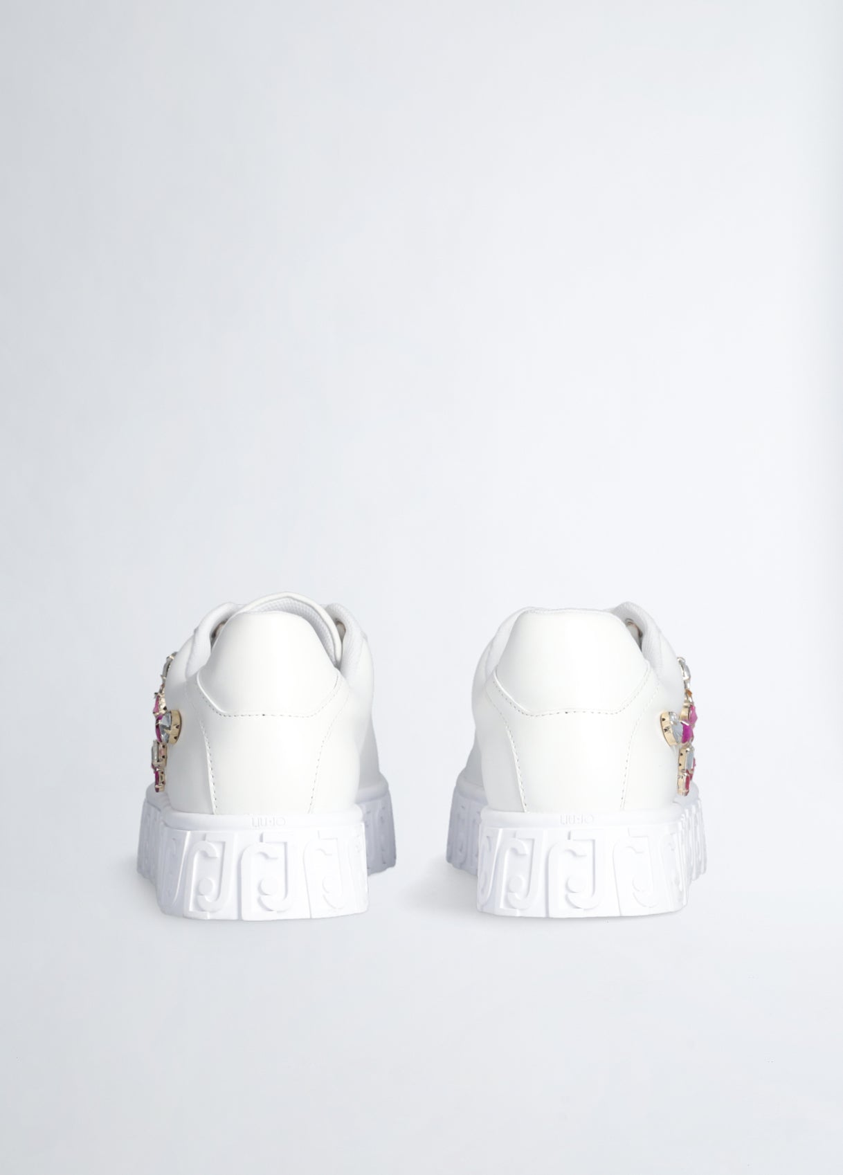 White sneakers with bejewelled gemstones