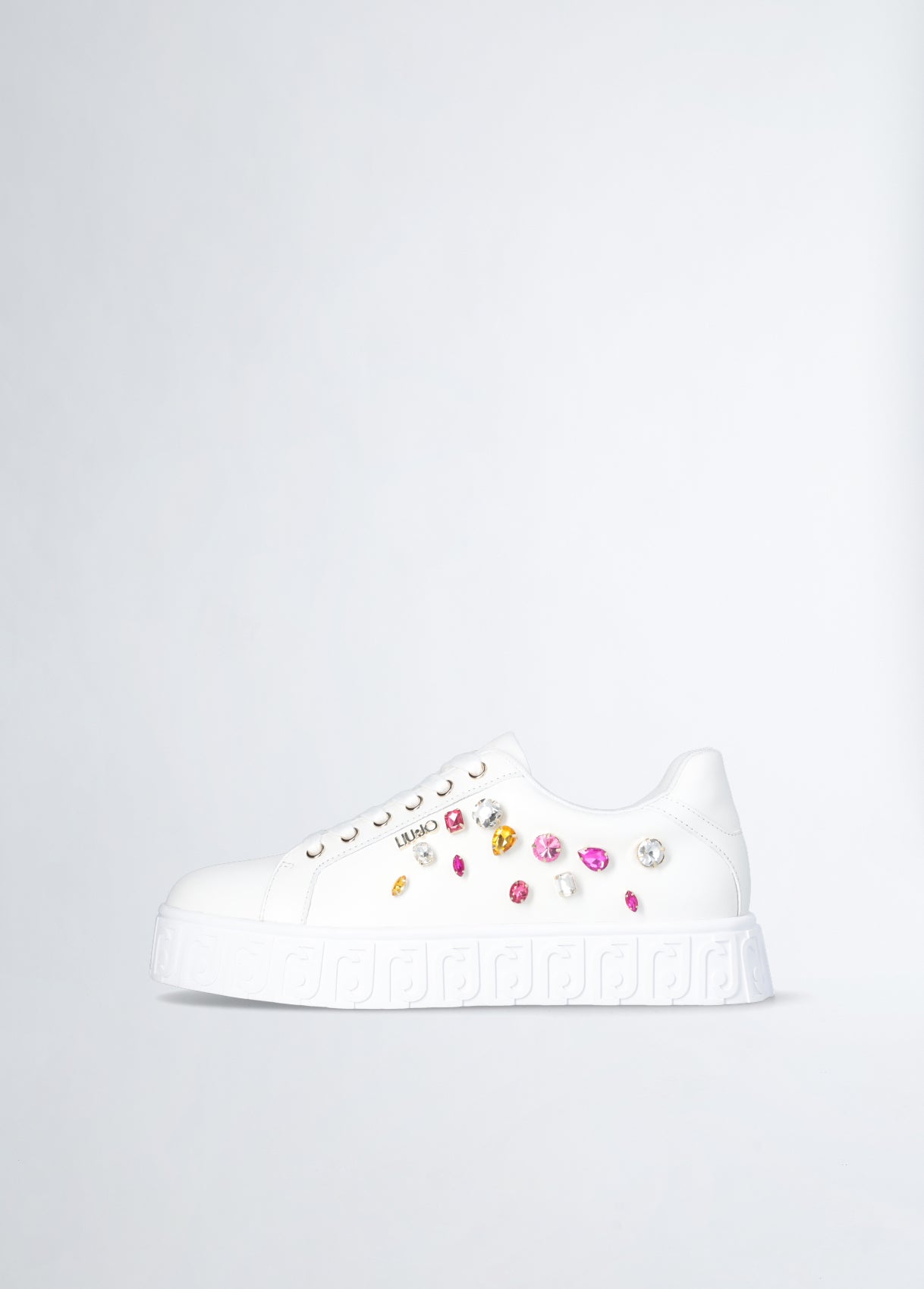 White sneakers with bejewelled gemstones