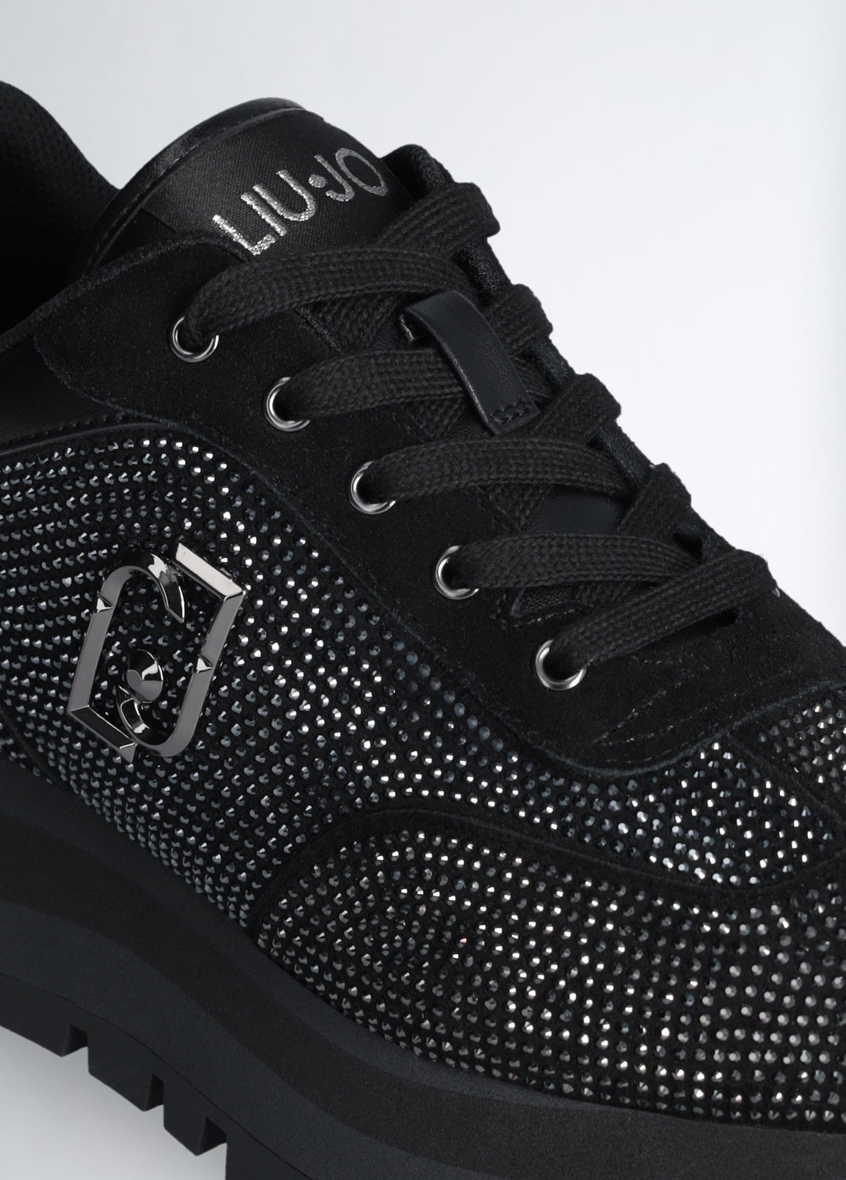 Black sneakers with all-over rhinestones