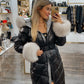 Padded black jacket with white fur