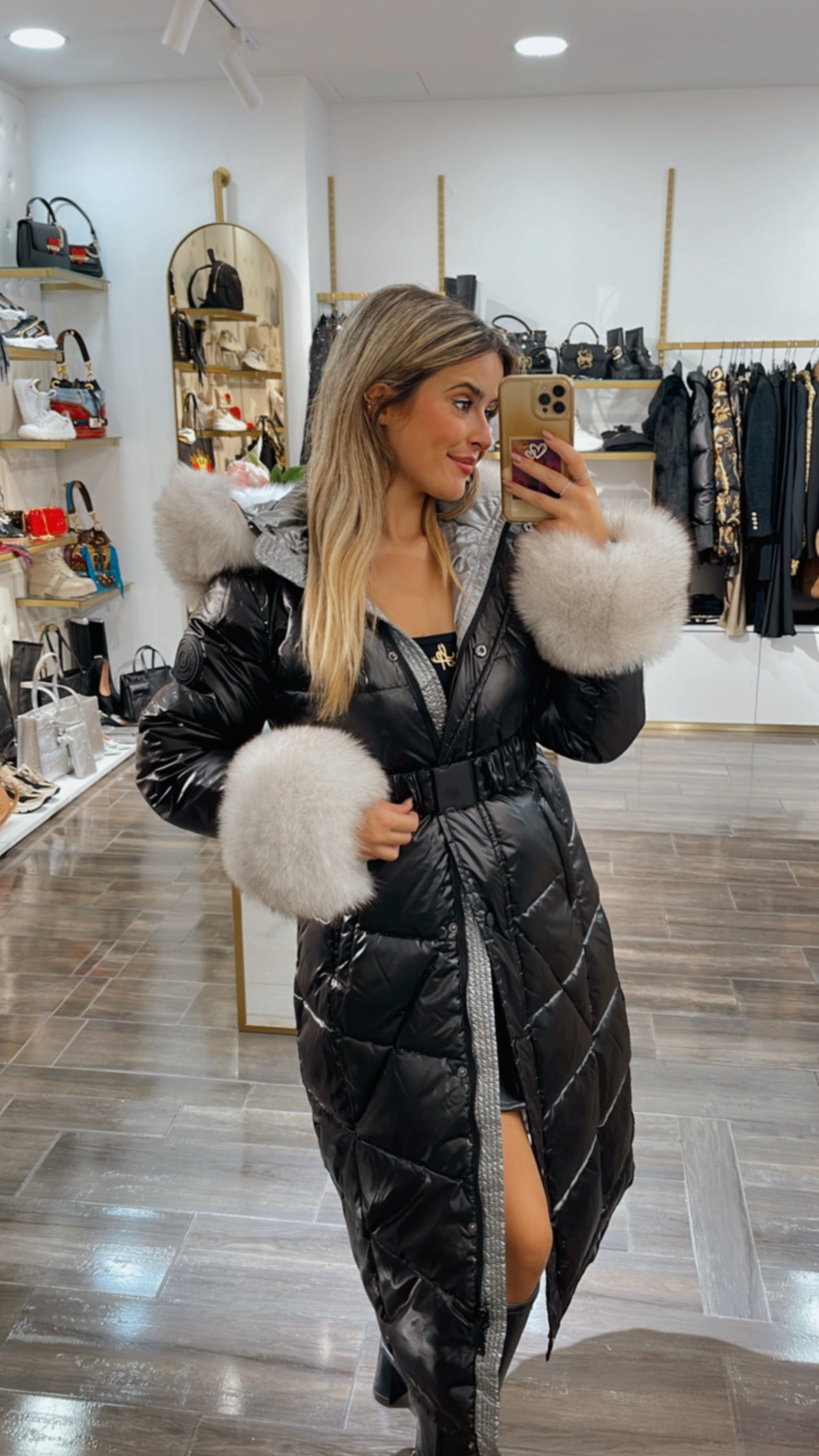 Padded black jacket with white fur