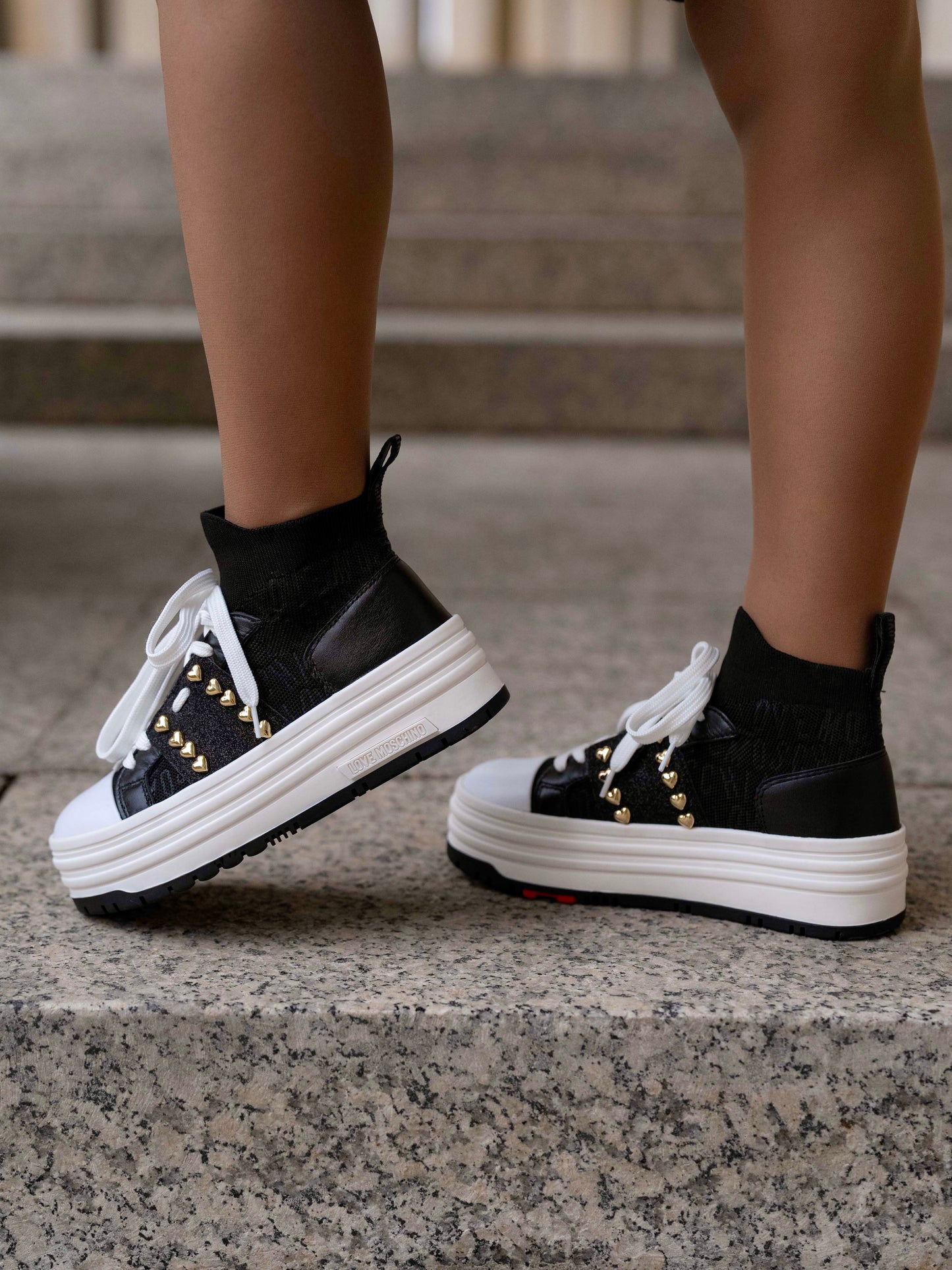 Black sneaker with double platform