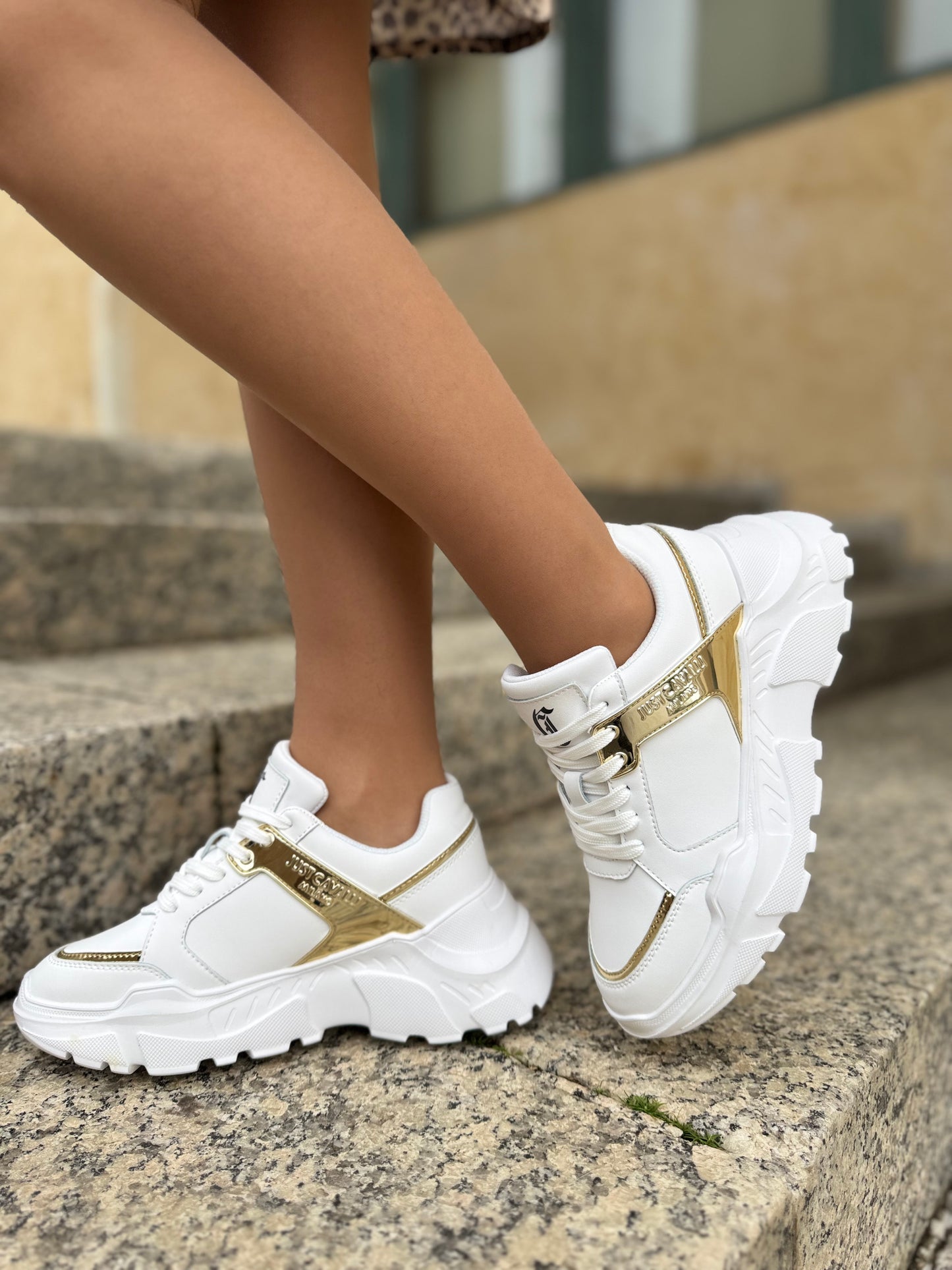 White and gold sneaker