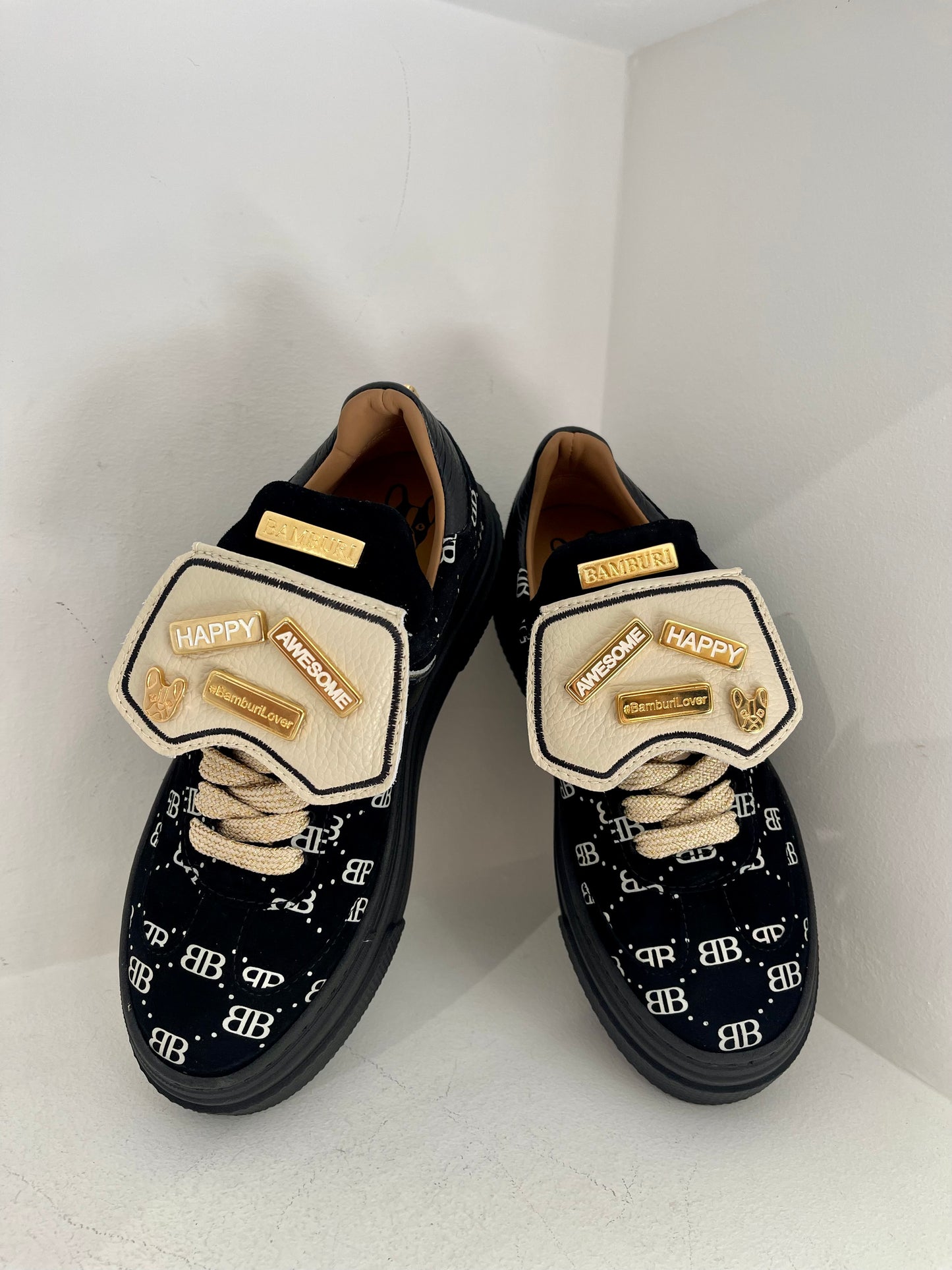 Black sneaker with gold details