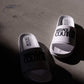 Shelly logo-embossed slides