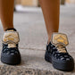 Black sneaker with gold details