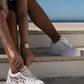 White sneakers with bejewelled gemstones