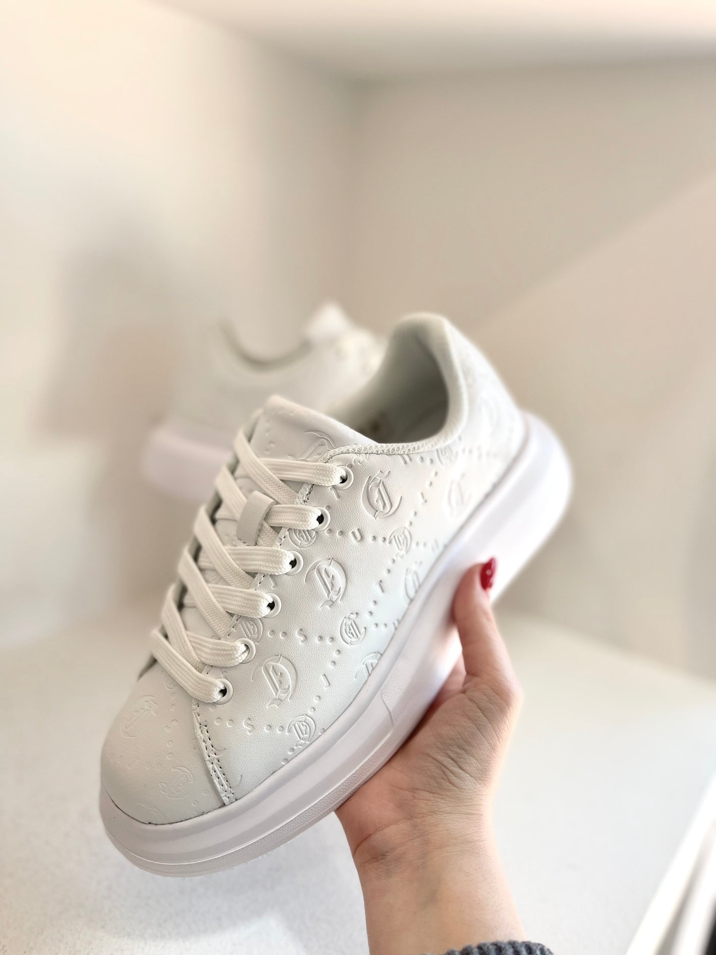 White embrossed sneaker