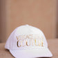 White cap with gold lettering