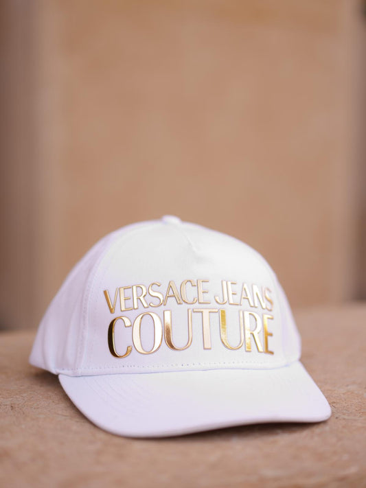 White cap with gold lettering