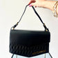 Plisse black handbag