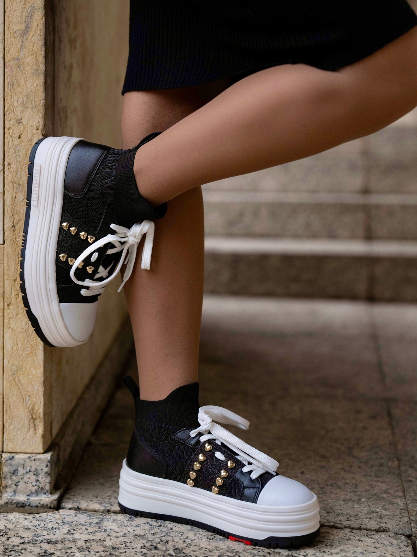 Black sneaker with double platform