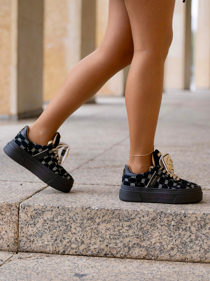 Black sneaker with gold details