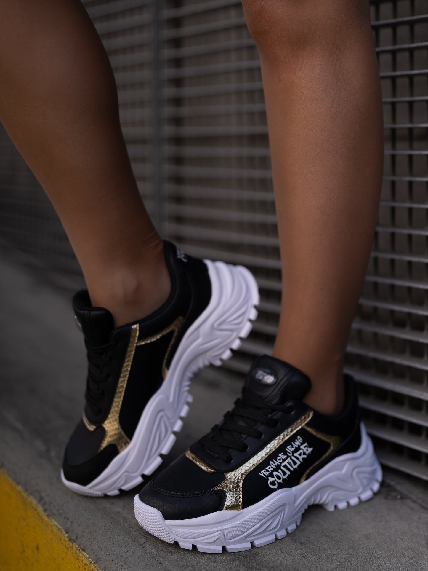 Black and gold sneaker