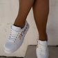 White sneakers with bejewelled gemstones