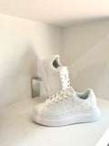 White embrossed sneaker