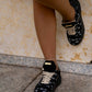 Black sneaker with gold details